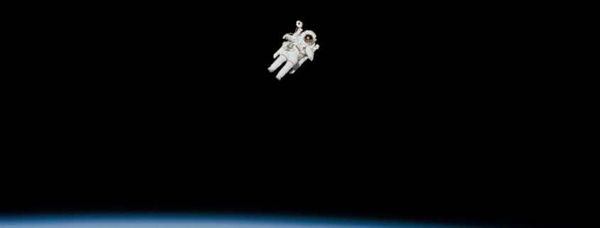 Astronaut floating above the Earth