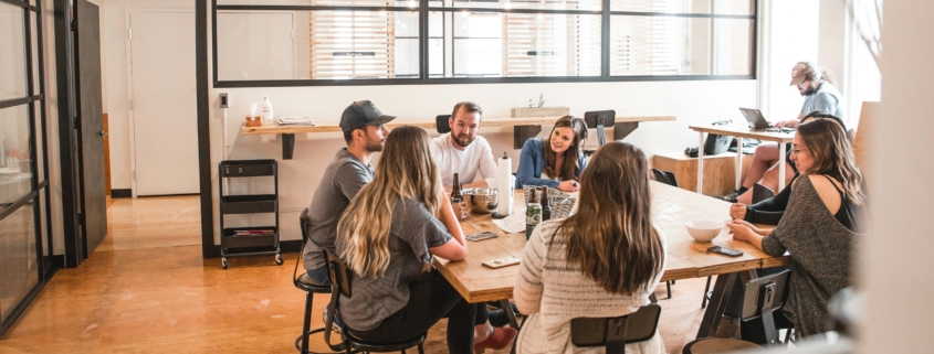 Several people meeting around a table